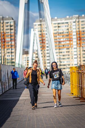 MOSCOW, RUSSIA - AUGUST 25, 2019: Two women on the bridge. Female portrait.のeditorial素材