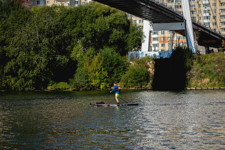 MOSCOW, RUSSIA - AUGUST 25, 2019: Kayaker man, kayaks on river, man boating on river. Race.のeditorial素材