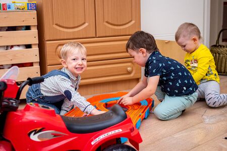 MOSCOW, RUSSIA - OCTOBER 12, 2019: Kid boy playing with toys at home or kindergarden.のeditorial素材