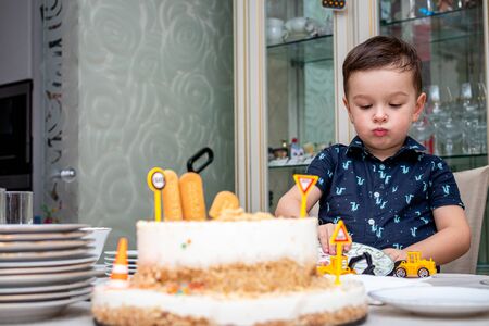 MOSCOW, RUSSIA - OCTOBER 12, 2019: Cute 3 years little boy and birthday cake.のeditorial素材