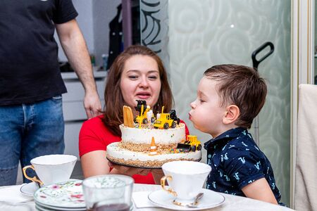 MOSCOW, RUSSIA - OCTOBER 12, 2019: Cute 3 years little boy and birthday cake.のeditorial素材