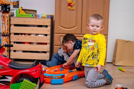 MOSCOW, RUSSIA - OCTOBER 12, 2019: Kid boy playing with toys at home or kindergarden.のeditorial素材