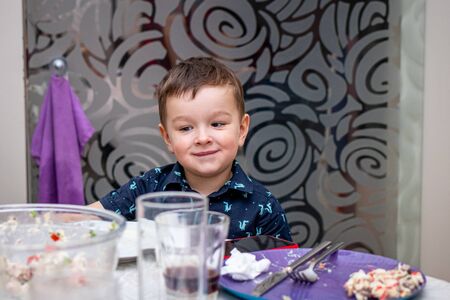 MOSCOW, RUSSIA - OCTOBER 12, 2019: Cute 3 years boy at the table during the birthday party.のeditorial素材