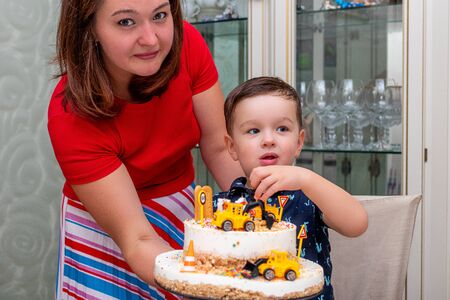 MOSCOW, RUSSIA - OCTOBER 12, 2019: Cute 3 years little boy and birthday cake.のeditorial素材