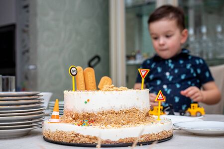 MOSCOW, RUSSIA - OCTOBER 12, 2019: Cute 3 years little boy and birthday cake.のeditorial素材