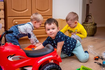 MOSCOW, RUSSIA - OCTOBER 12, 2019: Kid boy playing with toys at home or kindergarden.のeditorial素材