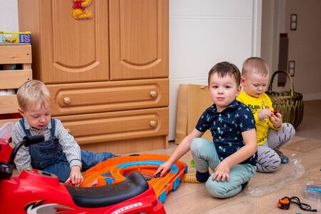 MOSCOW, RUSSIA - OCTOBER 12, 2019: Kid boy playing with toys at home or kindergarden.のeditorial素材