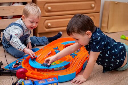 MOSCOW, RUSSIA - OCTOBER 12, 2019: Kid boy playing with toys at home or kindergarden.のeditorial素材