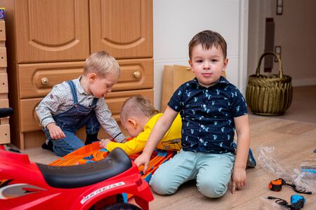 MOSCOW, RUSSIA - OCTOBER 12, 2019: Kid boy playing with toys at home or kindergarden.のeditorial素材