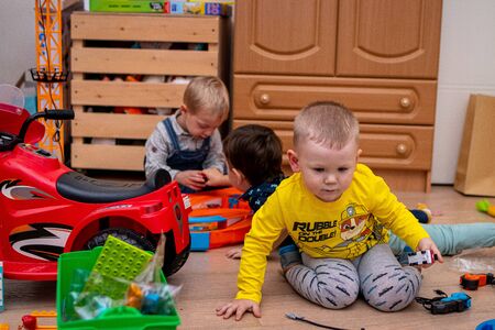 MOSCOW, RUSSIA - OCTOBER 12, 2019: Kid boy playing with toys at home or kindergarden.のeditorial素材