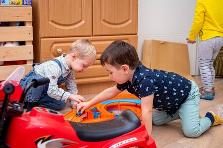 MOSCOW, RUSSIA - OCTOBER 12, 2019: Kid boy playing with toys at home or kindergarden.のeditorial素材