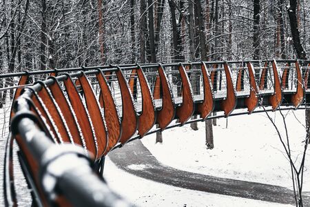 Snowy, wooden bridge in a winter day.の写真素材