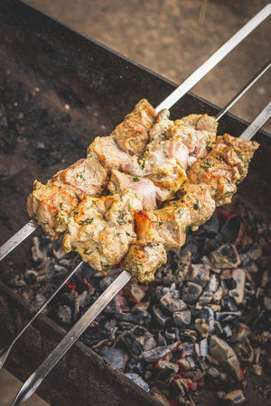 BBQ barbecuing skewers pork kebab, close up image. High quality photo.