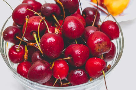 Sweet fresh red cherries in glassware. Summer lifestyle shot.の写真素材