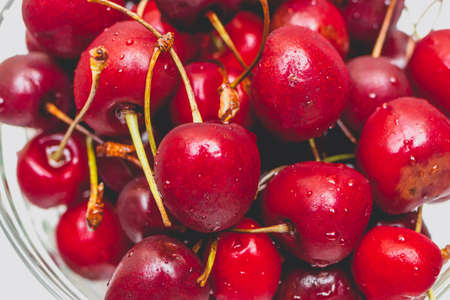Sweet fresh red cherries in glassware. Summer lifestyle shot.の写真素材