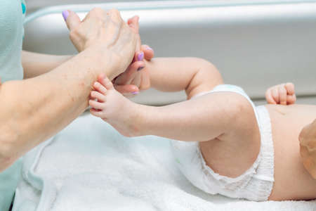 Baby massage closeup. Mother and child. Newborn.の写真素材