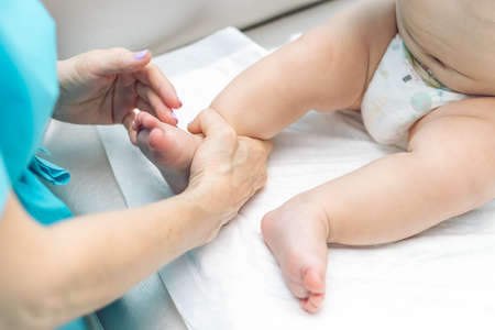 Baby massage closeup. Mother and child. Newborn.の写真素材