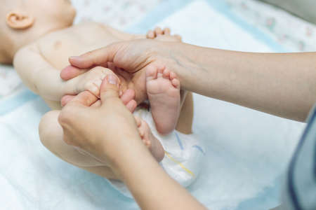Baby massage closeup. Mother and child. Newborn.の写真素材