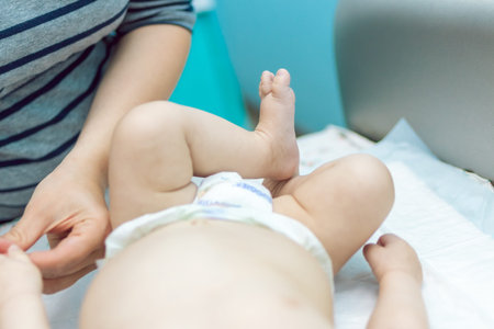 Baby massage closeup. Mother and child. Newborn.