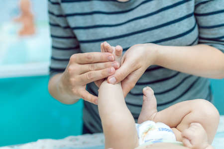 Baby massage closeup. Mother and child. Newborn.の写真素材