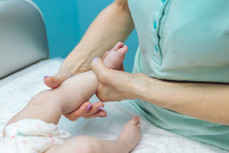 Baby massage closeup. Mother and child. Newborn.