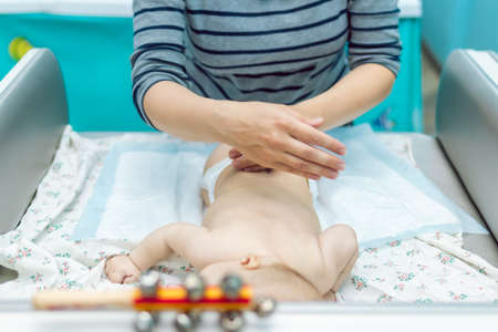 Baby massage closeup. Mother and child. Newborn.の写真素材