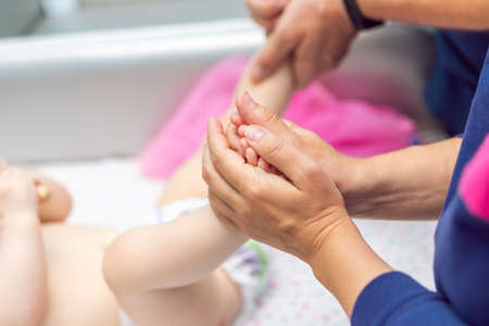 Baby massage closeup. Mother and child. Newborn.の写真素材