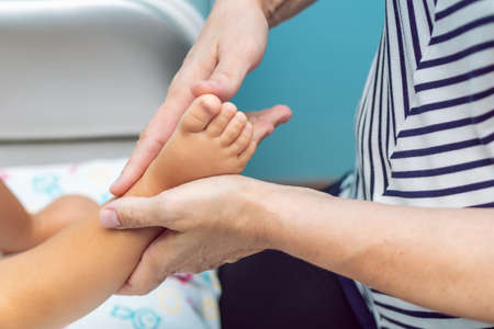 Baby massage closeup. Mother and child. Newborn.の写真素材