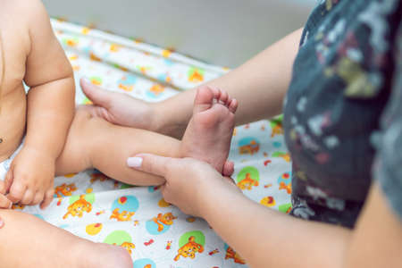 Baby massage closeup. Mother and child. Newborn.の写真素材