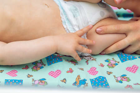 Baby massage closeup. Mother and child. Newborn.の写真素材