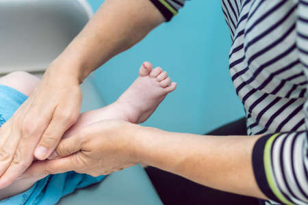 Baby massage closeup. Mother and child. Newborn.の写真素材