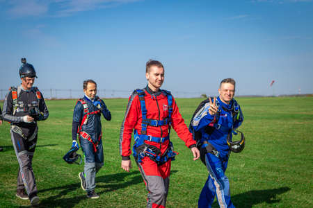 MOSCOW, RUSSIA - SEPTEMBER 27, 2020: Parachutists preparing for takeoff, walking to the aircraft.のeditorial素材