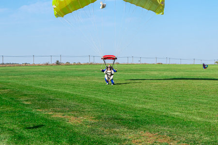 MOSCOW, RUSSIA - SEPTEMBER 27, 2020: Rarachutist lands on the ground.