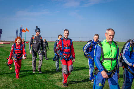 MOSCOW, RUSSIA - SEPTEMBER 27, 2020: Parachutists preparing for takeoff, walking to the aircraft.のeditorial素材