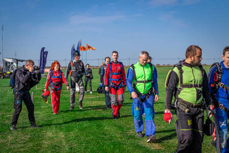 MOSCOW, RUSSIA - SEPTEMBER 27, 2020: Parachutists preparing for takeoff, walking to the aircraft.のeditorial素材