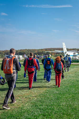 MOSCOW, RUSSIA - SEPTEMBER 27, 2020: Parachutists preparing for takeoff, walking to the aircraft.のeditorial素材