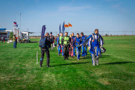 MOSCOW, RUSSIA - SEPTEMBER 27, 2020: Parachutists preparing for takeoff, walking to the aircraft.のeditorial素材