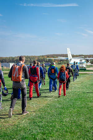 MOSCOW, RUSSIA - SEPTEMBER 27, 2020: Parachutists preparing for takeoff, walking to the aircraft.のeditorial素材