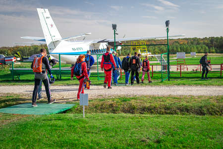 MOSCOW, RUSSIA - SEPTEMBER 27, 2020: Parachutists preparing for takeoff, walking to the aircraft.のeditorial素材