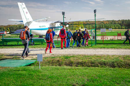 MOSCOW, RUSSIA - SEPTEMBER 27, 2020: Parachutists preparing for takeoff, walking to the aircraft.のeditorial素材