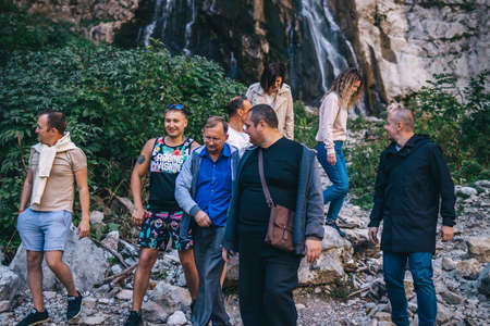 MOSCOW, RUSSIA - OCTOBER 25, 2020:Â Group of tourist near the waterfall.のeditorial素材