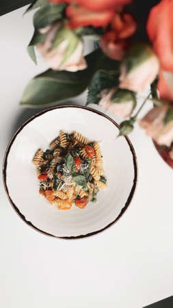 Vegetarian Italian pasta shot on a white background.の写真素材