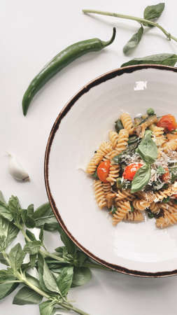 Vegetarian Italian pasta shot on a white background.の写真素材