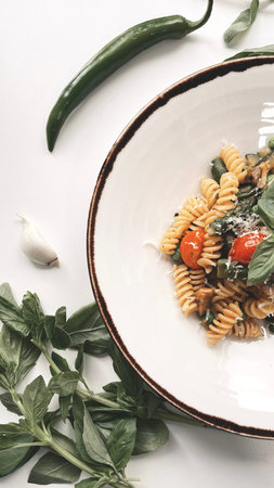 Vegetarian Italian pasta shot on a white background.