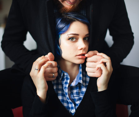 sensual portrait of a young girl in a man's arms
