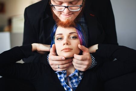 sensual portrait of a young girl in a man's armsの写真素材