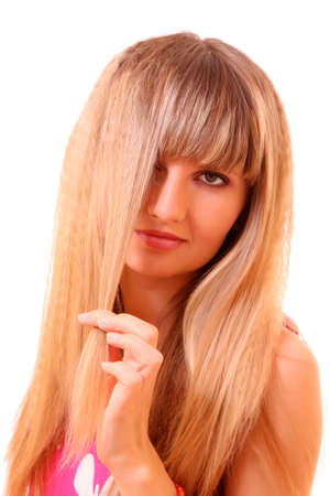Beautiful young girl combing hairの写真素材