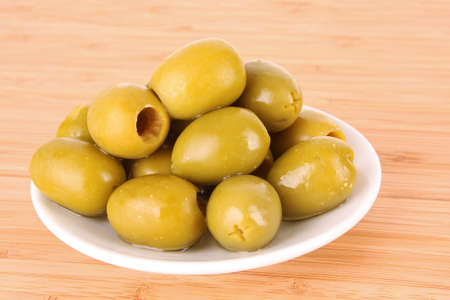 Olives on the wooden tableの写真素材