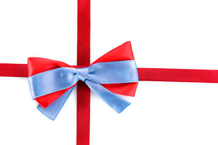 Gift red ribbon and bow isolated on white backgroundの写真素材