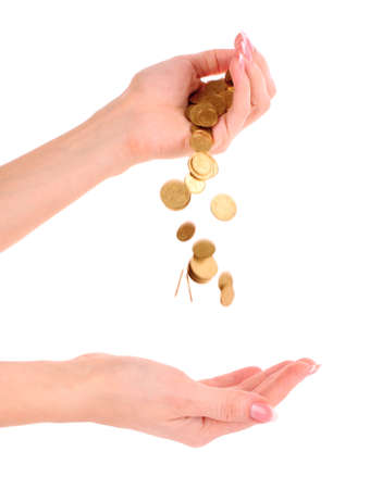 Hand and falling coins isolated on white backgroundの写真素材